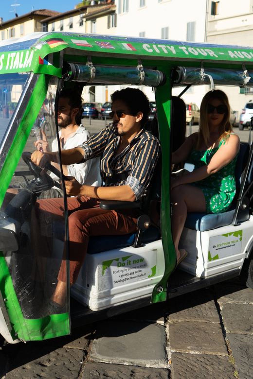 Florence: 60-Minute Eco-Friendly Golf Cart City Tour - Passing under the Vasari Corridor: a rare-feeling moment from the road