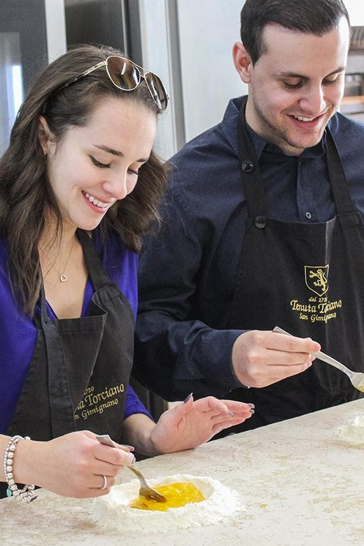 From Livorno: Authentic italian Pasta Cooking Class - Tenuta Torciano Winery: a welcoming setup for a small group