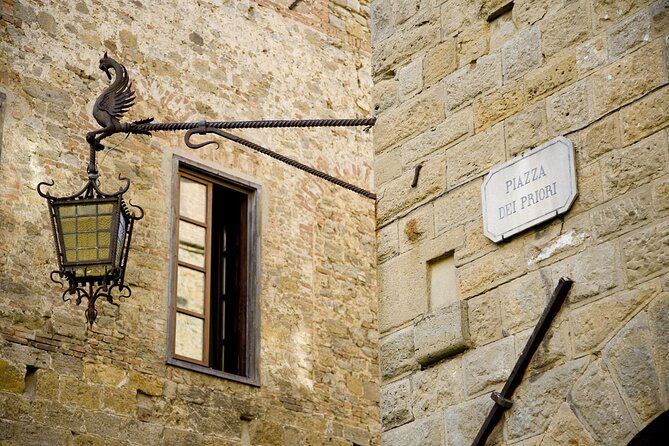 Private guided tour of the medieval village of Volterra - Stop 1: Palazzo dei Priori—frescoes, the bell tower, and the town map in your head